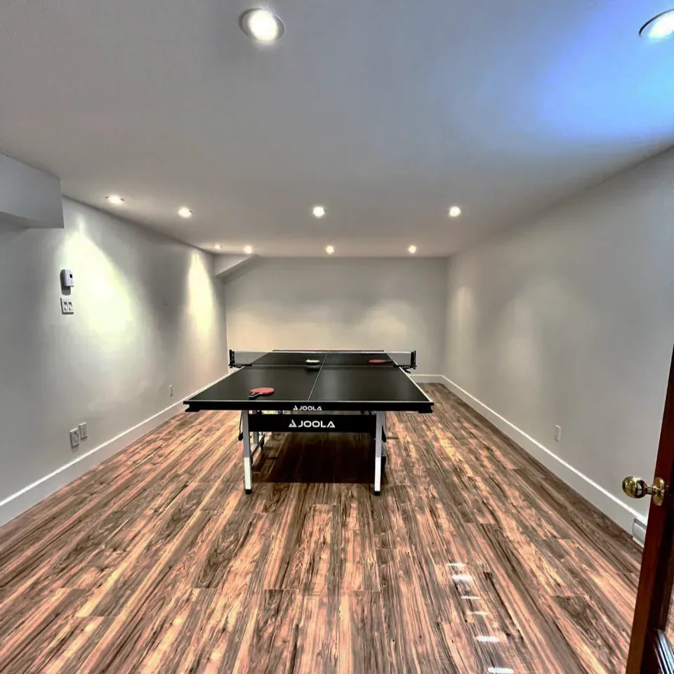 Basement games room with table tennis and recessed lighting