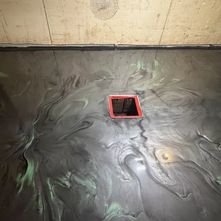 Metallic epoxy floor coating freshly applied in a garage