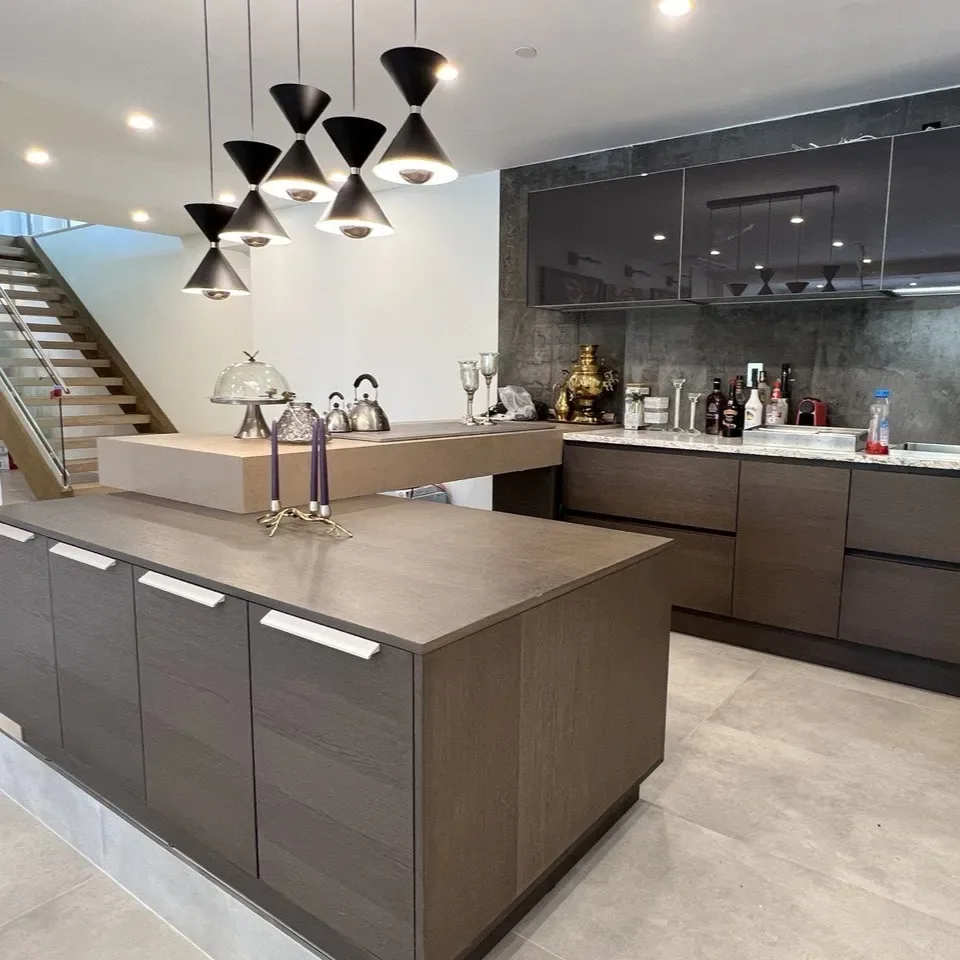 Dark wood kitchen with large island and pendant lighting